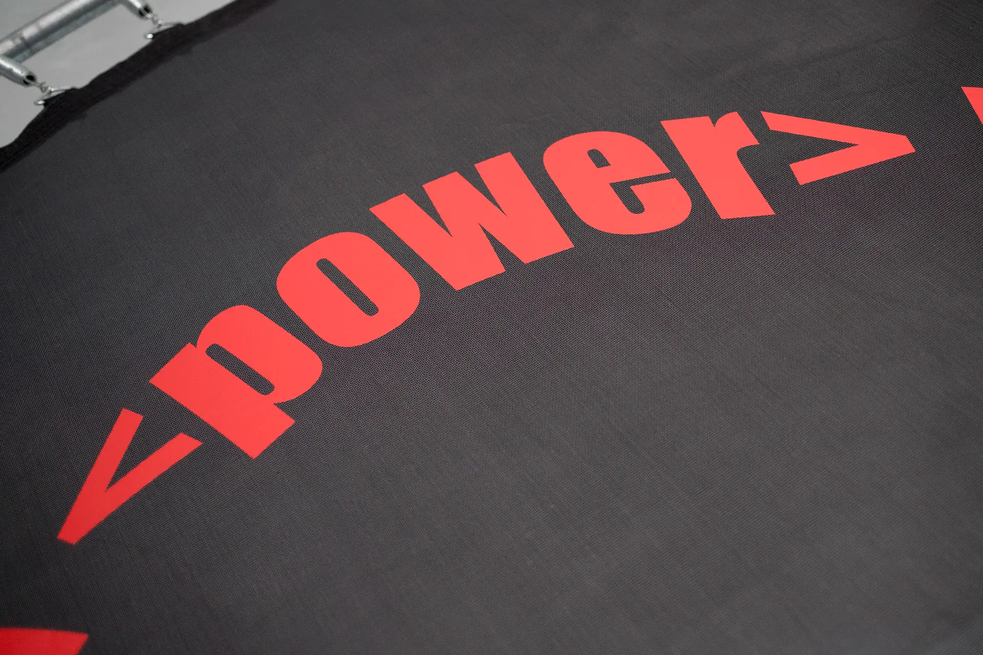 Radical Power — close-up of the red lettering on the trampoline mesh